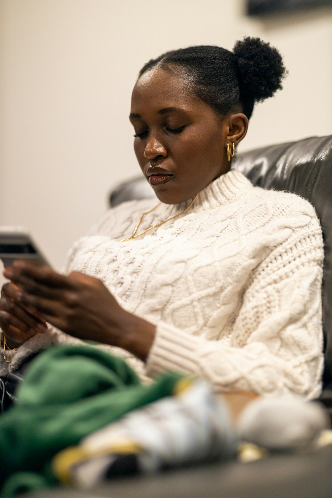 Woman reviewing digital insurance documents and data charts on a tablet